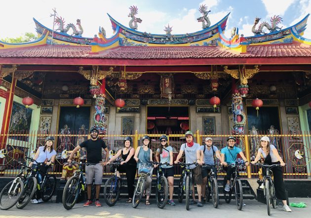 Group cycling tour at Chinese temple in Yogyakarta